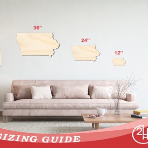 May include: Sizing guide for wooden state of Iowa cutouts. Three sizes are shown: 36 inches, 24 inches, and 12 inches. The cutouts are on a white wall behind a light pink sofa.
