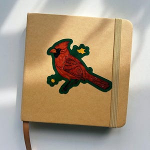 Sticker vinyle cardinal nord