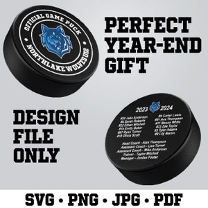 May include: Black and white hockey puck with a blue wolf logo and the text "Official Game Puck Northlake Wolves 2023" on the top. The puck has the text "2023" and "2024" with player numbers and names on the bottom. The text "Perfect Year-End Gift" is above the puck and the text "Design File Only SVG. PNG. JPG. PDF" is below the puck.