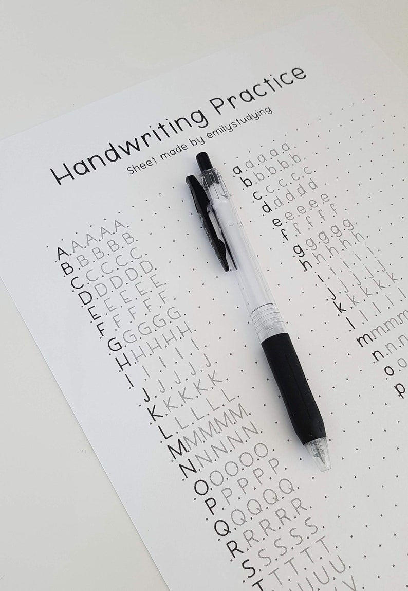 May include: A black pen lies on a white sheet of paper with a dotted pattern. The paper has the text "Handwriting Practice" and a list of the alphabet in ascending order, with each letter repeated five times.