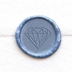 May include: A blue wax seal with a diamond design.