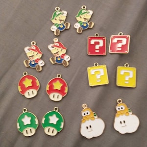 Super Mario charm set of 14 charms. Great for to use as charms for a charm bracelet or necklace.