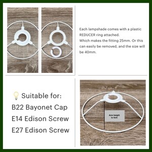 May include: A white metal lampshade frame featuring a removable plastic reducer ring. The fitting is 25mm with the ring and 40mm without. The arm height is 4cm. It is compatible with B22 Bayonet Cap, E14 Edison Screw, and E27 Edison Screw light bulb bases.