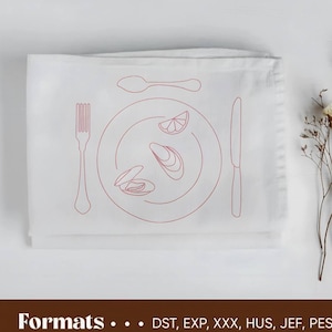 May include: A white linen napkin with a red line drawing of a plate, fork, knife, and spoon. The plate has a lemon wedge and three scallops inside.