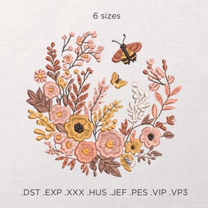 May include: Embroidered floral design in a circular arrangement, featuring flowers in shades of pink, yellow, and brown, with two butterflies. The text "6 sizes" is at the top. Below the design are file type extensions: .DST .EXP .XXX .HUS .JEF .PES .VIP .VP3.