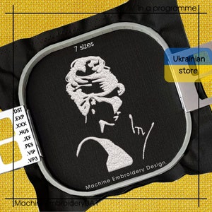 May include: A white embroidery design of a woman's face with a signature on a black fabric background. The design is in a circular embroidery hoop with a silver rim. The text "7 sizes" and "Machine Embroidery Design" are visible. The text "Ukrainian store" is in a yellow and blue rectangle.