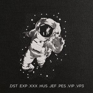 May include: Embroidered image of an astronaut floating in space against a black background. The astronaut is wearing a white spacesuit and surrounded by white stars. The image includes the text: .DST .EXP .XXX .HUS .JEF .PES .VIP .VP3.