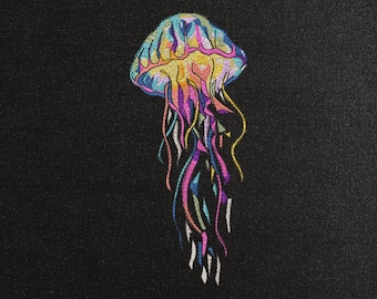 May include: A colorful jellyfish with pink, blue, yellow, and green tentacles on a black background. The text .DST .EXP .XXX .HUS .JEF .PES .VIP .VP3 is at the bottom of the image.