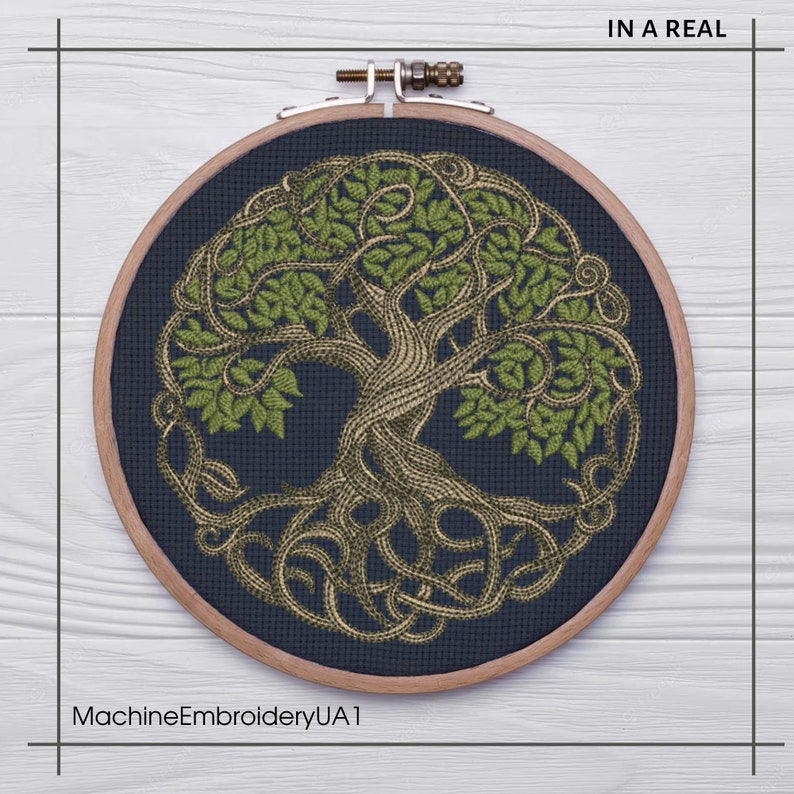 May include: A circular embroidery hoop with a dark blue background and a green and gold embroidered tree of life design. The text "IN A REAL" is in the upper right corner of the image. The text "MachineEmbroideryUA1" is in the lower left corner of the image.