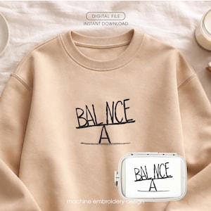 May include: A white ceramic mug with a black handle and the text "But First, Coffee" in a bold, black font. The mug is set against a blurred background, suggesting a cozy setting.