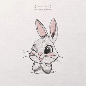 Può includere: Design ricamato di un coniglietto che fa l'occhiolino, con l'interno delle orecchie e le guance rosa. Il coniglietto è grigio chiaro con baffi e occhi neri. Il testo "DIGITAL FILE INSTANT DOWNLOAD" è sopra.