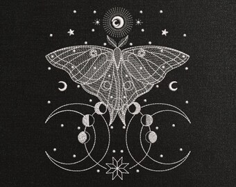 May include: Embroidered design on black fabric featuring a white moth with intricate wing patterns, surrounded by celestial elements like stars, moons, and a sun. The design includes the file formats: .DST .EXP .XXX .HUS .JEF .PES .VIP .VP3.