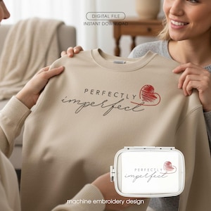 May include: A beige sweatshirt with the words "PERFECTLY imperfect" in black script and a red heart design. The image also includes a machine embroidery design with the same text and heart. The words "DIGITAL FILE" and "INSTANT DOWNLOAD" are also visible.