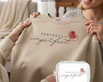 May include: A beige sweatshirt with the words "PERFECTLY imperfect" in black script and a red heart design. The image also includes a machine embroidery design with the same text and heart. The words "DIGITAL FILE" and "INSTANT DOWNLOAD" are also visible.