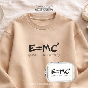 May include: A beige sweatshirt with the equation E=MC² printed in black. Below the equation is the text (ENERGY = MILK x COFFEE²). The image also shows a machine embroidery design with the same text. The words "DIGITAL FILE" and "INSTANT DOWNLOAD" are at the top.