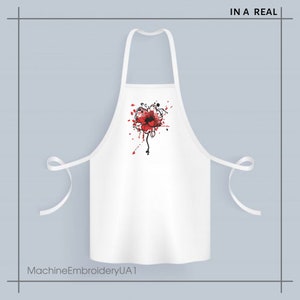 May include: White apron with a red poppy flower design and black paint splatters. The text "IN A REAL" is printed in the top right corner. The text "MachineEmbroideryUA1" is printed in the bottom left corner.