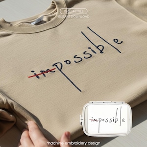 Könnte beinhalten: Beigefarbenes Sweatshirt mit dem Wort "impossible" in Marineblau und Rot gestickt. Das "im" ist durchgestrichen, wodurch sich das Wort in "possible" ändert. Das Bild enthält auch den Text "DIGITAL FILE INSTANT DOWNLOAD" und "machine embroidery design".