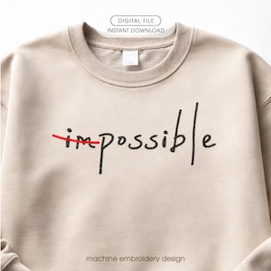 Puede incluir: Una sudadera beige con la palabra "impossible" bordada en negro, con la "im" tachada en rojo, transformando la palabra en "possible". La parte superior de la imagen tiene el texto "DIGITAL FILE INSTANT DOWNLOAD". La parte inferior de la imagen tiene el texto "machine embroidery design".