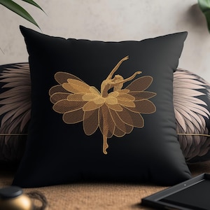 May include: Black decorative throw pillow featuring a gold embroidered ballerina design. The ballerina is depicted mid-dance, with arms raised and legs extended. The design is detailed and elegant, suitable for home decor.