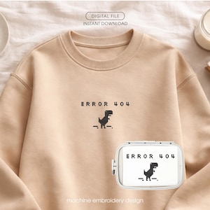 May include: A beige sweatshirt with the text "ERROR 404" and a pixelated dinosaur graphic. A matching white case with the same design is also visible. The words "DIGITAL FILE" and "INSTANT DOWNLOAD" are printed at the top.