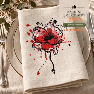 Pode incluir: Um guardanapo de linho bege com um design de bordado à máquina de uma flor abstrata vermelha e preta com detalhes de respingos de tinta. O texto MACHINE EMBROIDERY DESIGN e DIGITAL DOWNLOAD é visível no canto superior direito da imagem.