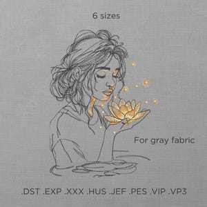 Può includere: Un disegno a linea di una donna con i capelli lunghi che tiene un fiore. Il fiore brilla di una luce dorata. L'immagine è per tessuto grigio e include il testo "6 dimensioni" e ".DST .EXP .XXX .HUS .JEF .PES .VIP .VP3".