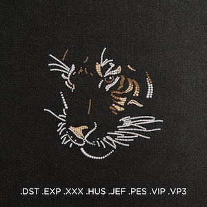 May include: A close-up of a tiger's face made of white and brown beads on a black background. The tiger's eye is a light brown color. The text '.DST .EXP .XXX .HUS .JEF .PES .VIP .VP3' is at the bottom of the image.
