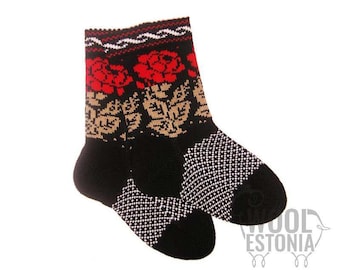 May include: A pair of black wool socks with a floral pattern. The socks feature red roses and tan leaves on the upper portion, with a white and black diamond pattern on the toes and heels. The top has a red and white zigzag design.