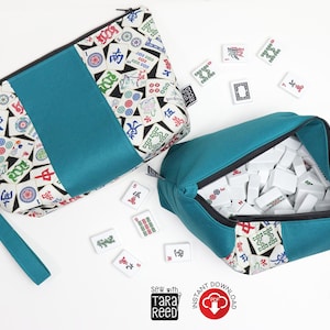 Two finished Mahjong tile bags made from sewing tutorial, showing wristlet strap, zipper closure, and structured bag shape