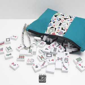 Handmade fabric Mahjong tile bag filled with American Mahjong tiles, zippered bag design that holds a full 166 tile set