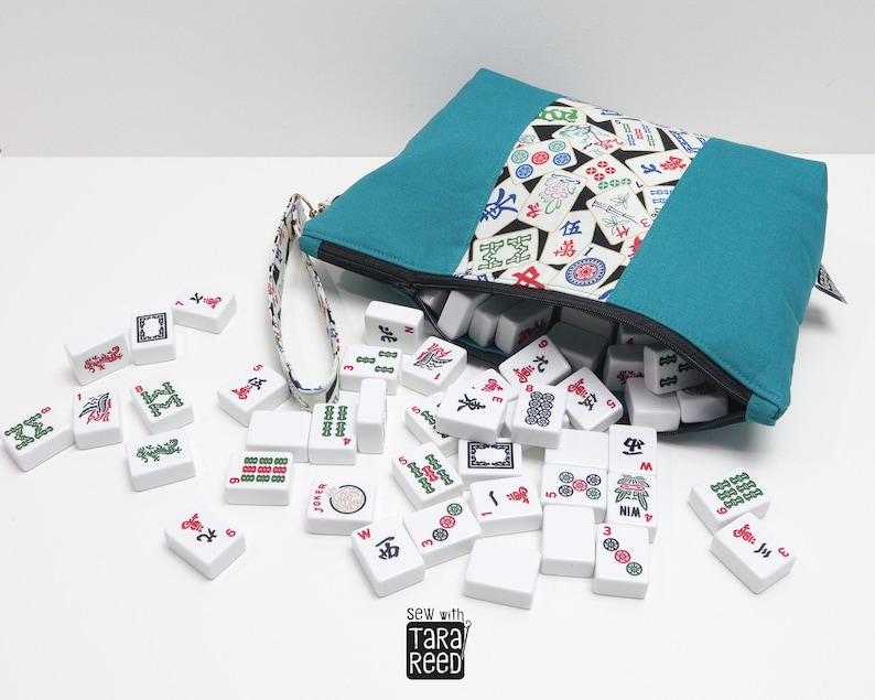 Handmade fabric Mahjong tile bag filled with American Mahjong tiles, zippered bag design that holds a full 166 tile set