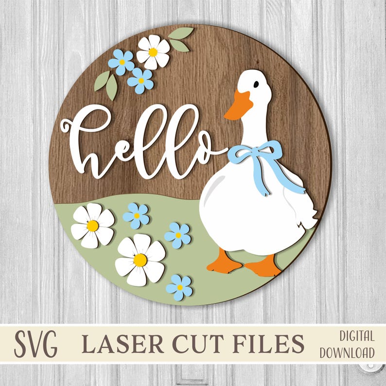 May include: A round wooden sign with a goose and floral design. The sign features a white goose with an orange beak and feet, a blue bow, and the word "hello" in white script. Blue and white flowers are scattered around the goose.