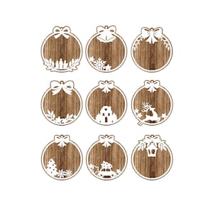 May include: Nine round wooden ornaments with white cut-out designs. The designs include a bow, a bell, a reindeer, a house, a Christmas tree, a car, and a lantern.
