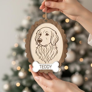 May include: Wooden dog ornament with a scalloped edge frame. The ornament features a detailed engraved portrait of a Golden Retriever and a bone-shaped tag with the name "TEDDY". A twine loop is attached for hanging.