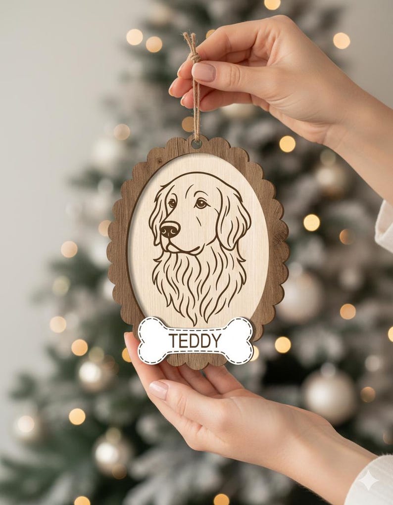 May include: Wooden dog ornament with a scalloped edge frame. The ornament features a detailed engraved portrait of a Golden Retriever and a bone-shaped tag with the name "TEDDY". A twine loop is attached for hanging.