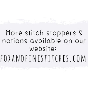 May include: White background with text that reads "More stitch stoppers & notions available on our website: FOXANDPINESTITCHES.COM". The text is in a handwritten style font.