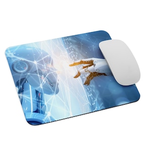 May include: A computer mouse and mousepad featuring a futuristic design. The mousepad depicts a blue-toned image of two robot figures with a network of glowing lines. A white wireless mouse sits on the right side of the pad.