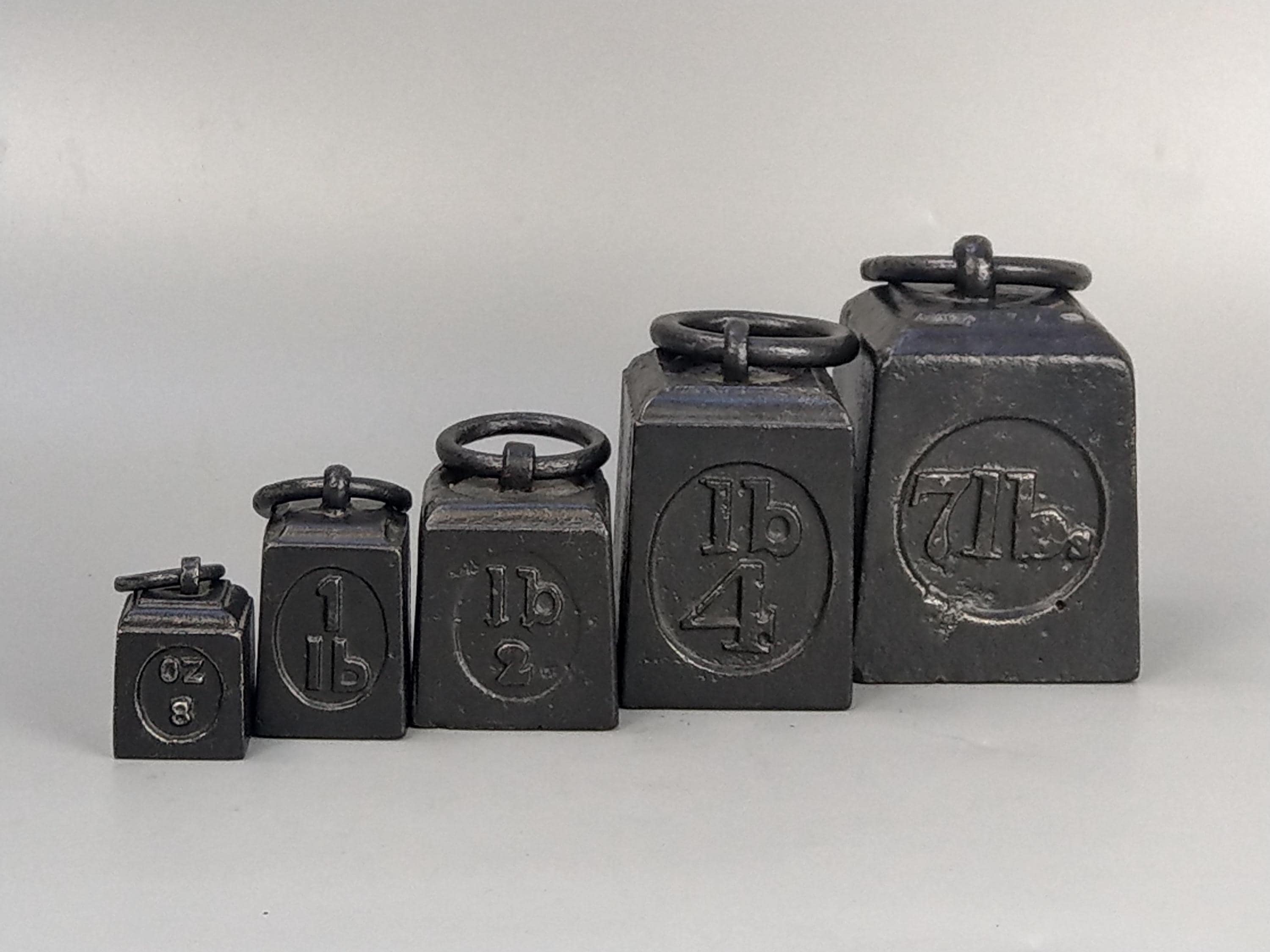 Set of 5 Victorian scale weights with ring top handle