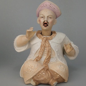 Antique Nodder figurine Chinese Emperor with tonggue Bisque porcelain