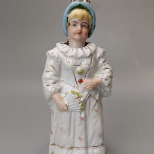 Nodding head figurine Girl in harlequin costume German Bisque porcelain