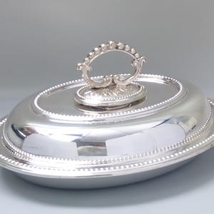 Meat serving dish silver-plated oval with beaded rim and top handle