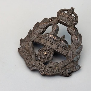 Military cap badge East Lancashire Regiment Officer&#39;s Service Dress King&#39;s Crown