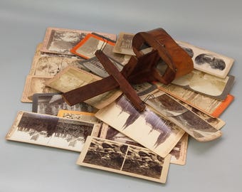 Estereoscópio de madeira antigo com seleção de cartas