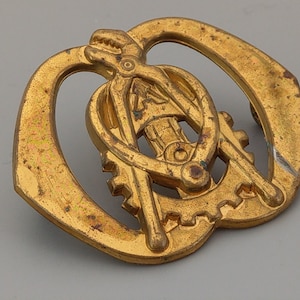 Military Cap Badge Holland: Army Ordnance Electrical and Mechanical Engineers