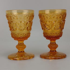 Pair of Vallerysthal & Portieux Amber Glass Arabesque Wine Goblets