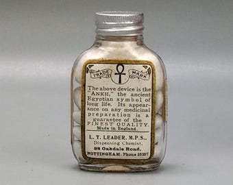 Medicine bottle labelled Easton Syrup Tablets Ankh trade mark L. T. Leader