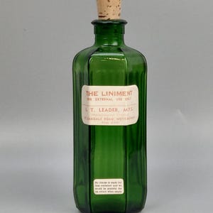 Antique Emerald Green pharmacy bottle with label Liniment L.T Leader Nottingham