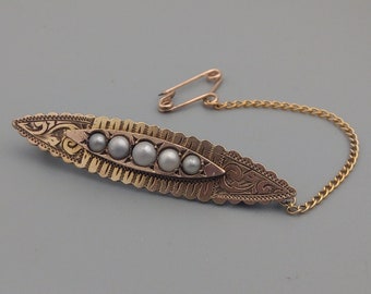 Ovale broche Opgerold goud met zadenparel