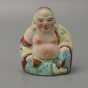 Small sitting laughing Buddha biscuit porcelain figure