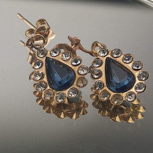 9ct Gold earrings pear shaped with blue stone surrounded cubic zirconia